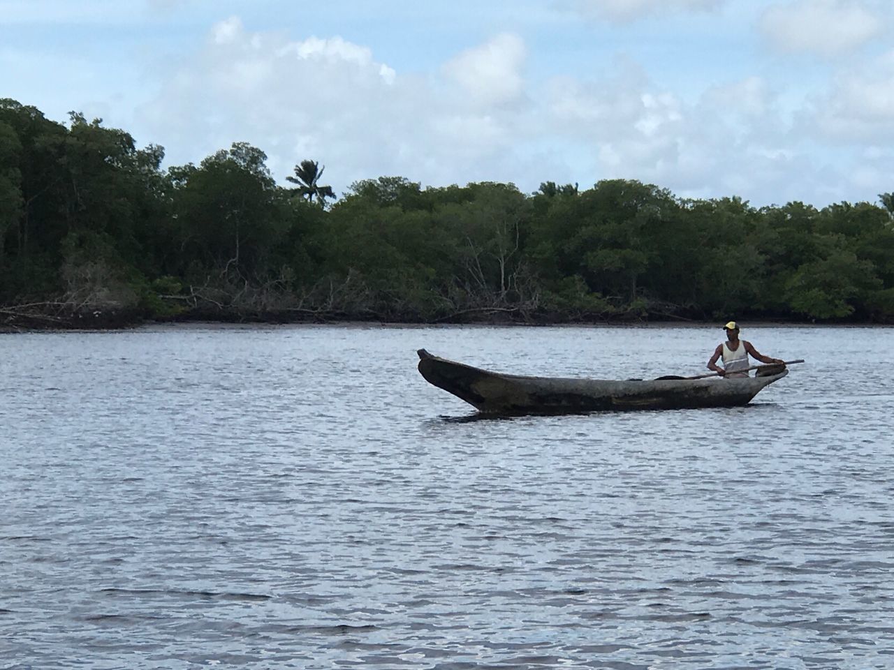 nautical vessel, water, lifestyles, tree, nature, day, lake, sky, tranquil scene, outdoors, beauty in nature, one person, people