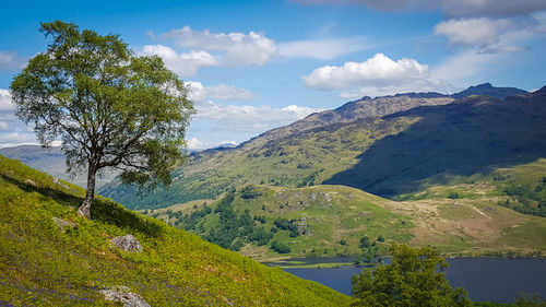 Scenic view of mountains against cloudy sky