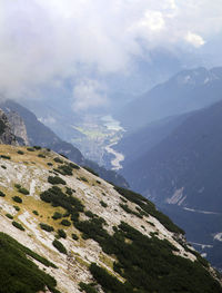 Scenic view of dolomites against cloudy sky