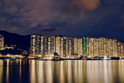 Panoramic view of city lit up at night