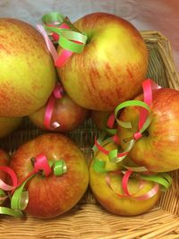 High angle view of apples in basket on table