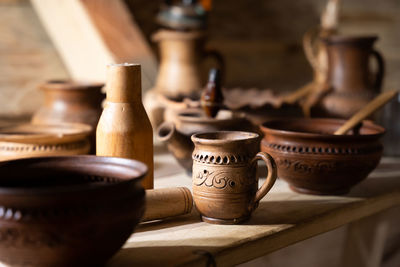 Ukrainian handmade clay dishes. applied and hutsul ceramics. clay jug, cups, bowl.