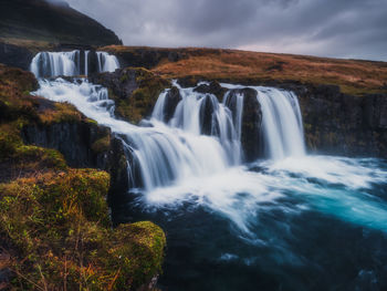 Scenic view of waterfall in iceland
