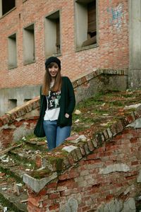 Full length of man standing in front of building