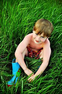 Girl standing on grassy field