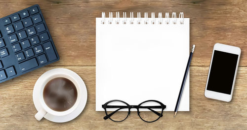 High angle view of coffee cup on table