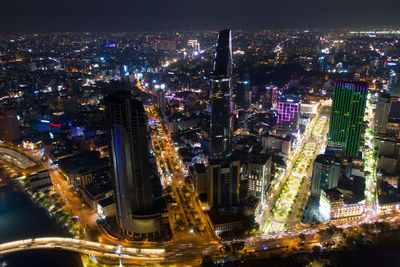 High angle view of illuminated city buildings at night