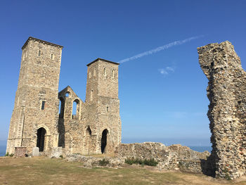 Low angle view of reculver castle building against sky