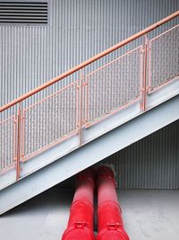 Pipes below staircase by building