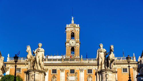 Low angle view of a building against blue sky