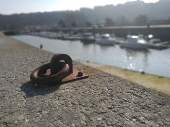 Close-up of metal by river
