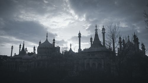 Low angle view of church against cloudy sky