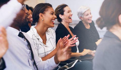 Happy business colleagues working at office