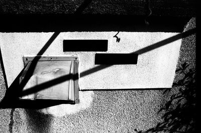 Close-up of shadow on tiled floor