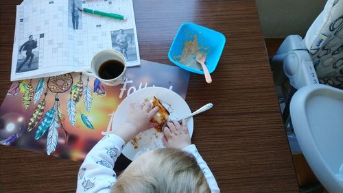 High angle view of coffee cup on table