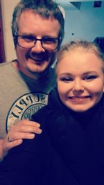 Close-up portrait of a smiling young couple