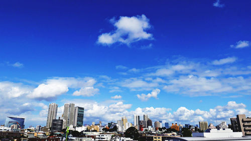 Buildings in city against sky