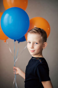 Portrait of boy with balloons