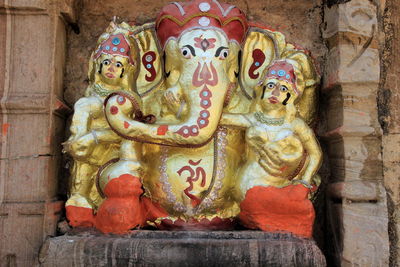 Sculpture of buddha statue outside temple