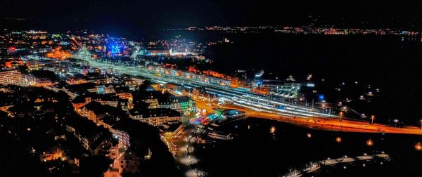 High angle view of illuminated bridge over river at night