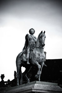 Low angle view of statue against sky