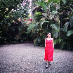 Woman standing by plants