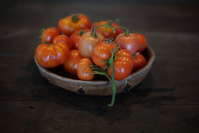 Close-up of fruits in basket on table