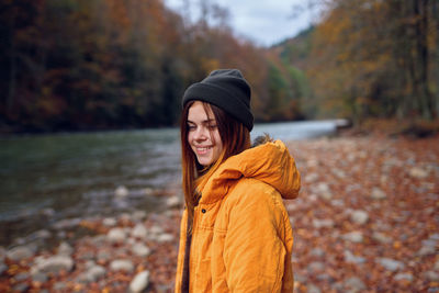 Young woman looking at camera during autumn