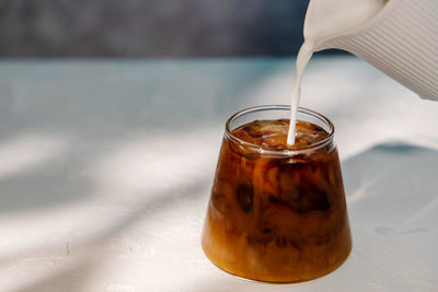 Close-up of drink in glass jar on table