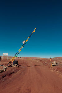 Construction site in desert against clear blue sky