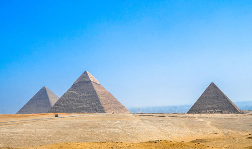View of pyramids in egypt against clear blue sky