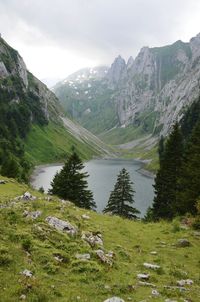 Scenic view of valley and mountains against sky