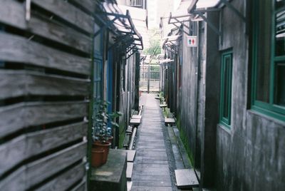 Empty alley amidst houses