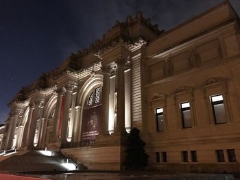 Facade of illuminated building at night