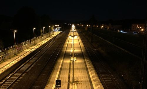 High angle view of railway tracks at night