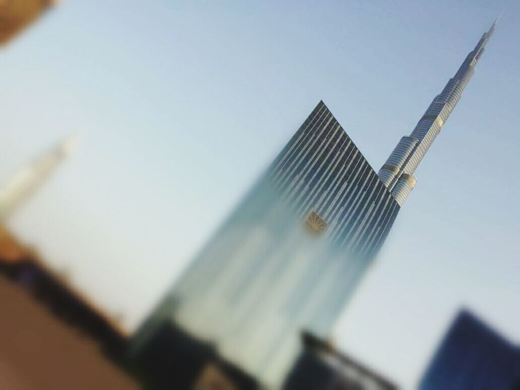 LOW ANGLE VIEW OF OFFICE BUILDING AGAINST SKY