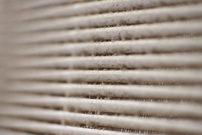 Extremely dirty air ventilation grill of hvac with dusty clogged filter, macro. close up. cleaning