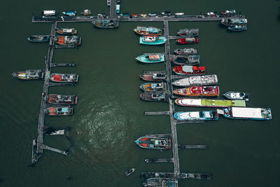 High angle view of boats moored at harbor