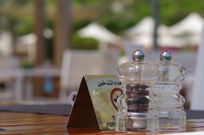 Close-up of salt and pepper shaker on table