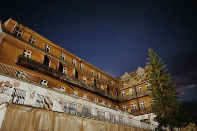 Low angle view of built structure against sky at night