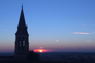 Scenic view of illuminated cathedral against sky at night