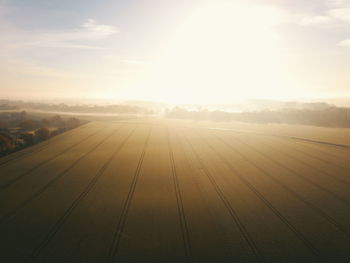 Scenic view of field against sky during sunset