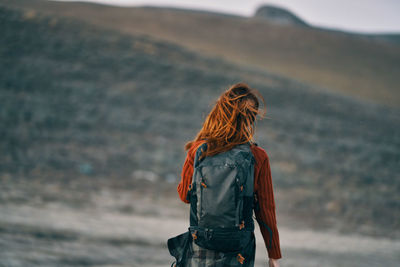 Rear view of woman looking at sea