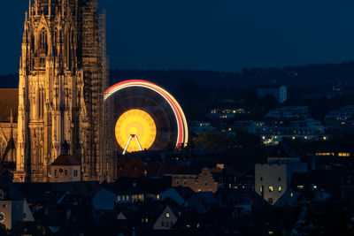 Illuminated buildings in city at night