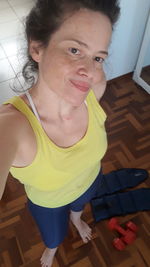 Portrait of smiling woman at home