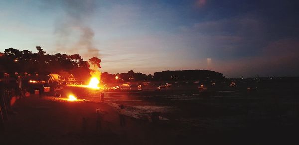 Silhouette trees against sky during sunset