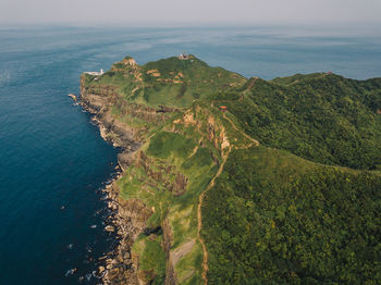 High angle view of sea shore against sky