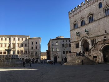 Low angle view of historical building against clear blue sky