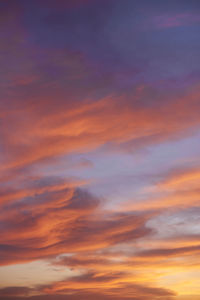 Low angle view of orange cloudy sky