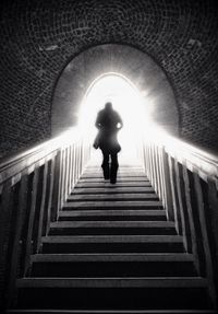 Low angle view of woman in tunnel